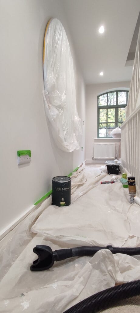 Professional Painters & Decorators painting hallway with Little Greene White paint