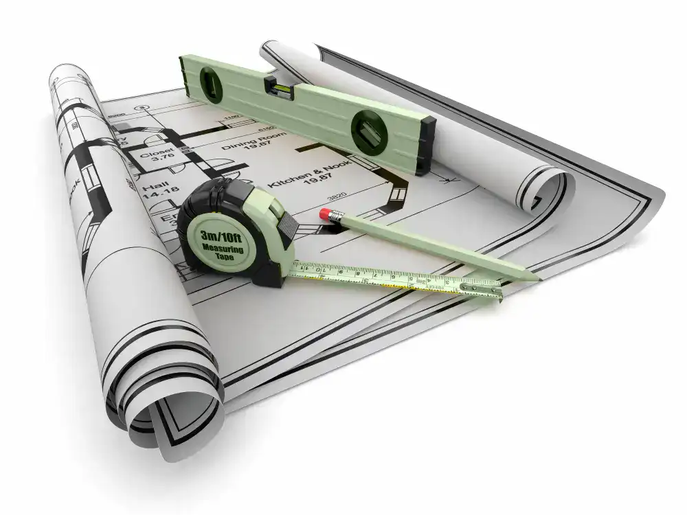A set of construction plans and tools on top of a white background